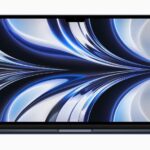 MacBook Air in midnight displaying a wallpaper.  