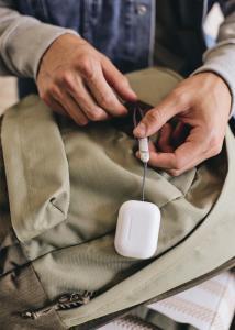 Lanyard loop attached to a backpack on the all-new charging case of the second-generation AirPods Pro.